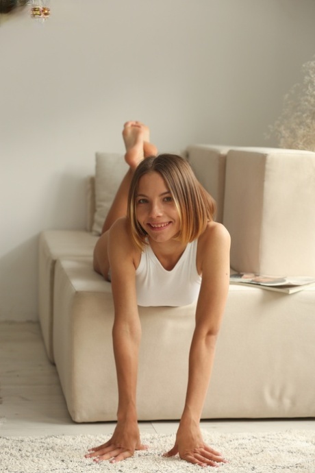 Young beauty Julie gets totally naked in a confident manner 25179522